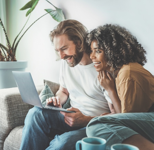 happy couple applying for payday loan online